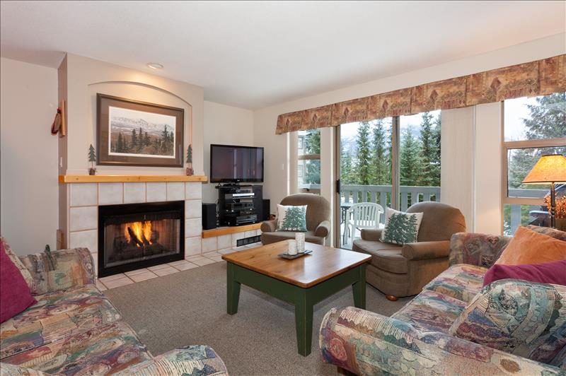 Whistler Accommodations - Living room with flatscreen and fireplace - Rentals By Owner