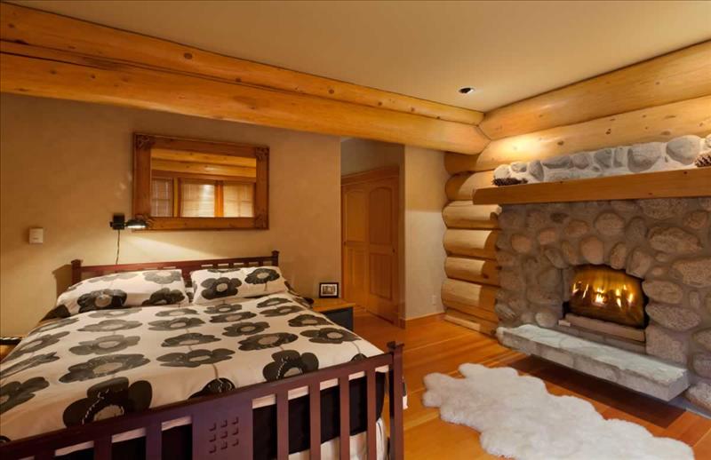 Whistler Accommodations - Whistler Log Home Bedroom with Fireplace - Rentals By Owner