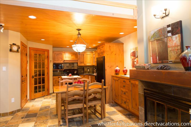 Whistler Accommodations - View from couch and balcony looking in.  Enjoy a log on the fireplace while interacting with others - Rentals By Owner