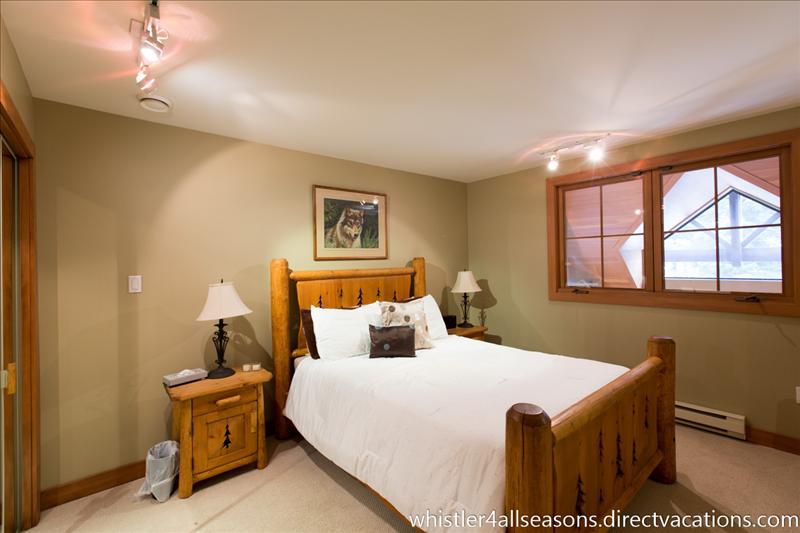 Whistler Accommodations - Master features a queen bed, television, DVD player, living room view below or trees & closet - Rentals By Owner