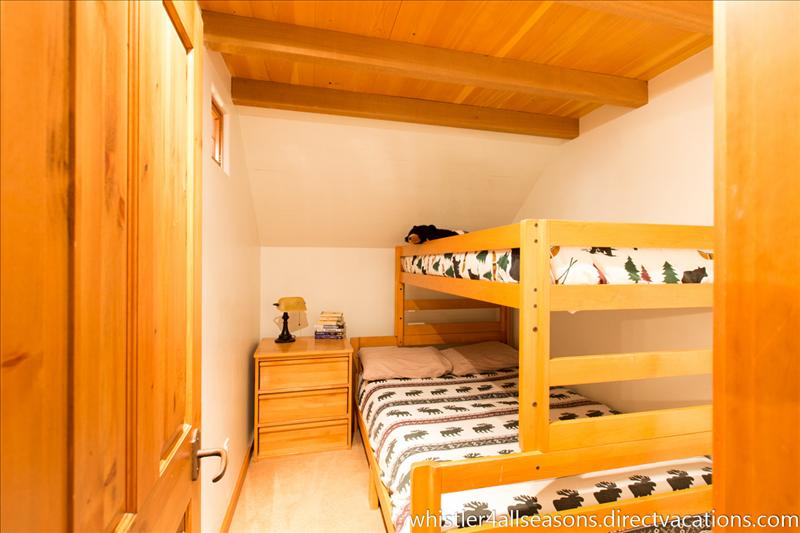 Whistler Accommodations - Guest bedroom features a queen bed with a single bunk - sleeps three - Rentals By Owner