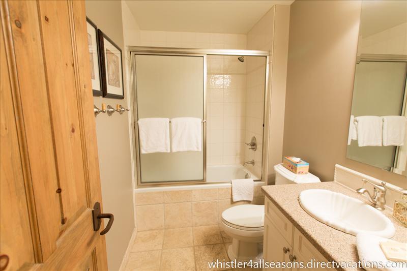 Whistler Accommodations - Main bath features heated flooring, Jacuzzi tub, rain shower head and hair dryer - Rentals By Owner
