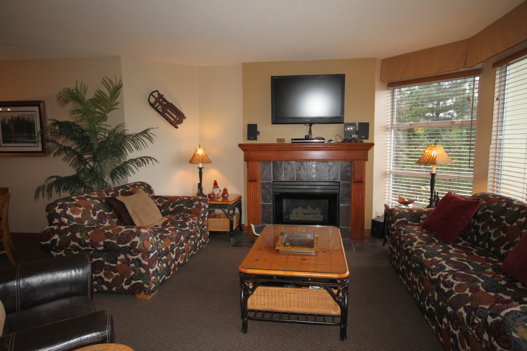 Whistler Accommodations - Living area with flat screen TV and fireplace - Rentals By Owner
